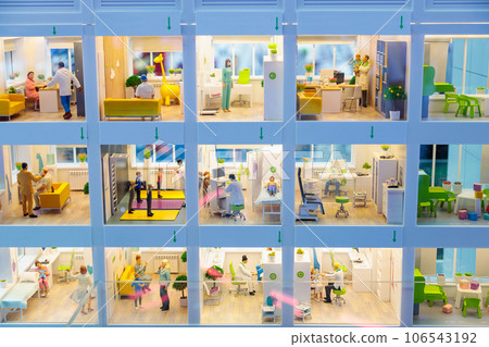 Layout of a large city polyclinic, models of rooms with equipment and people. Layout of a large city polyclinic, models of rooms with equipment and people. 106543192