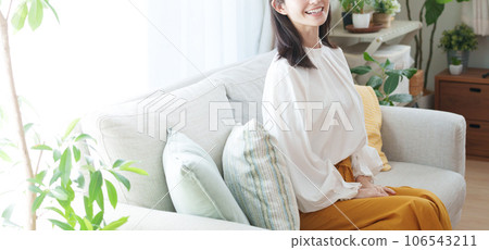 A woman with a smile at the camera's eyes A woman with a smile at the camera's eyes 106543211