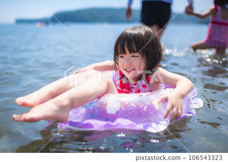 A girl enjoying swimming in the summer sea 106543323