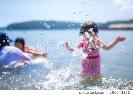 Sisters enjoying swimming in the summer sea 106543328