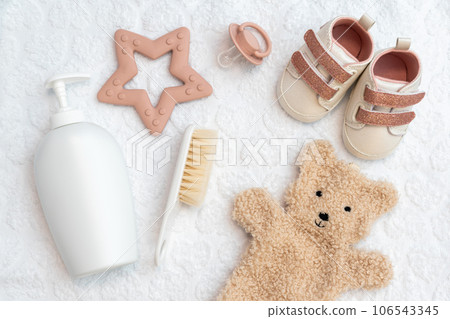 Newborn's world in a snapshot, top view of infant accessories arranged in an elegant flat lay, essential post-giving birth items Newborn's world in a snapshot, top view of infant accessories arranged in an elegant flat lay, essential post-giving birth items 106543345