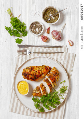 Baked Split Chicken Breasts on plate, top view 106543947