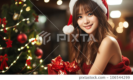 Santa Claus woman and Christmas present 106544299