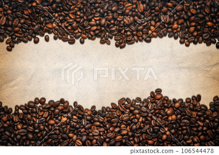 Large Group of Roasted Coffee Beans on a Blank Parchment Large Group of Roasted Coffee Beans on a Blank Parchment 106544478