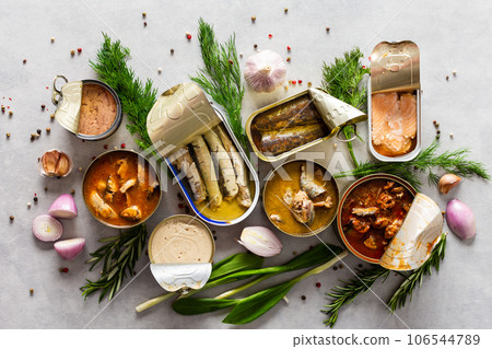 Open tin cans with canned fish Open tin cans with canned fish 106544789