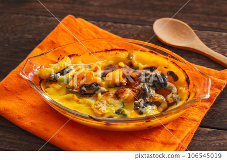 Mushroom and pumpkin gratin 106545019