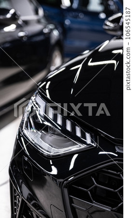 Beautiful shiny paint on a black car after applying a ceramic coating Beautiful shiny paint on a black car after applying a ceramic coating 106545187