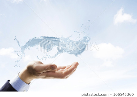 Hands with water splash . Mixed media 106545360