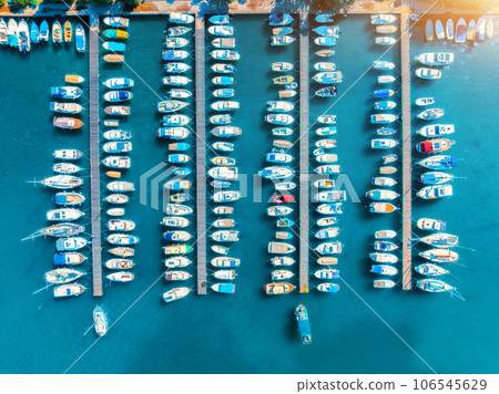 Aerial view of boats and yachts in dock at sunset in summer 106545629