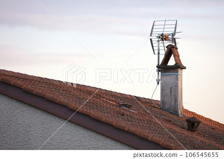 Old type antenna on the roof of house Old type antenna on the roof of house 106545655
