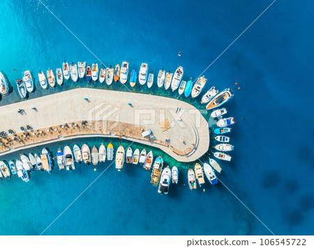 Aerial view of boats and yachts in dock at sunset in summer Aerial view of boats and yachts in dock at sunset in summer 106545722