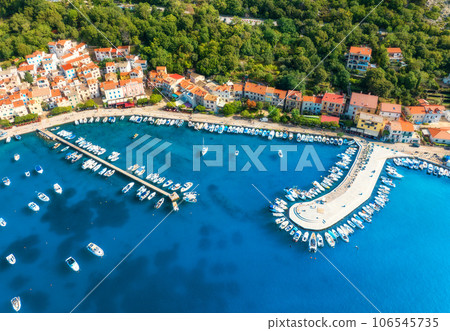 Aerial view of boats and yachts, buildings at summer sunset 106545735