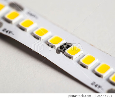 Superbright diode tape on a white background, lighting. Macro Superbright diode tape on a white background, lighting. Macro 106545795