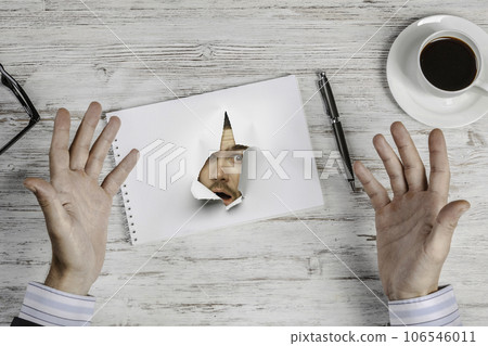 Male face through the hole in paper Male face through the hole in paper 106546011