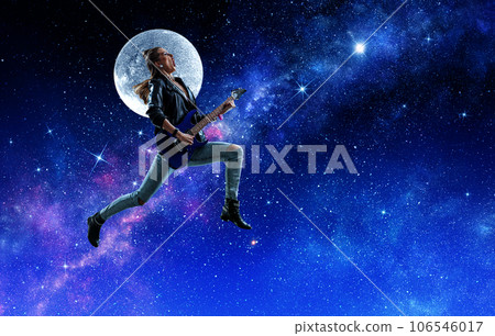 Young and beautiful rock girl playing the electric guitar 106546017