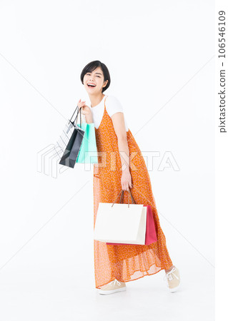 Young woman shopping on white background 106546109