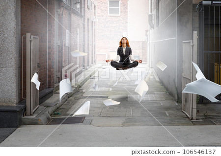 Beautiful businesswoman meditating . Mixed media Beautiful businesswoman meditating . Mixed media 106546137