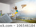 Young woman jumping in the air 106546184