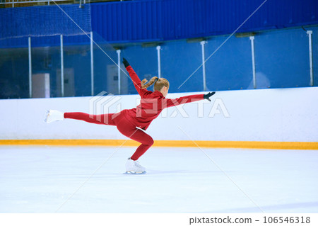 Talented, hardworking and concentrated girl, figure skating athlete in motions, training on ice rink arena Talented, hardworking and concentrated girl, figure skating athlete in motions, training on ice rink arena 106546318
