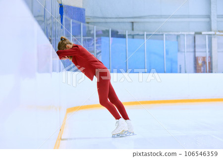Ups and downs. Challenges. Girl, figure skating athlete feeling tired and exhausted after hard training session on ice rink arena Ups and downs. Challenges. Girl, figure skating athlete feeling tired and exhausted after hard training session on ice rink arena 106546359