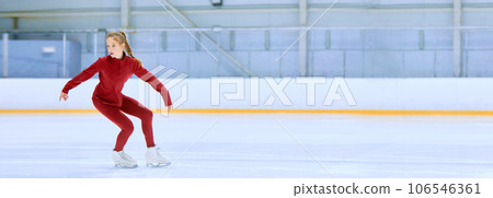 Talented and concentrated girl in red sportswear, figure skating athlete in motion, training on ice rink arena 106546361