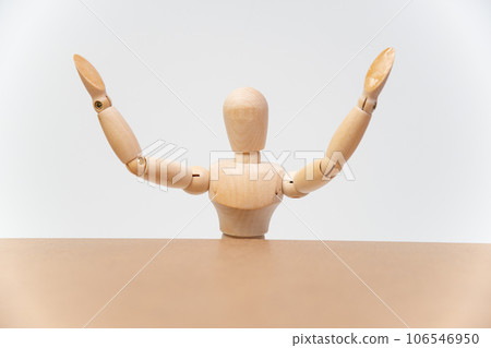 A drawing doll raising both hands in a speech A drawing doll raising both hands in a speech 106546950