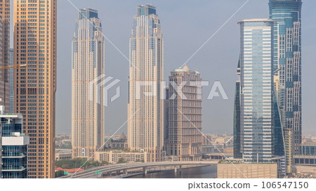 Cityscape with skyscrapers of Dubai Business Bay and water canal aerial timelapse. 106547150