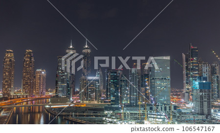 Cityscape with skyscrapers of Dubai Business Bay and water canal aerial night timelapse. Cityscape with skyscrapers of Dubai Business Bay and water canal aerial night timelapse. 106547167