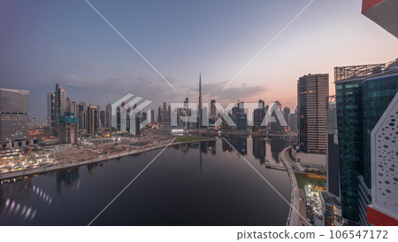 Aerial panorama of Dubai Business Bay and Downtown with the various skyscrapers and towers night to day timelapse Aerial panorama of Dubai Business Bay and Downtown with the various skyscrapers and towers night to day timelapse 106547172