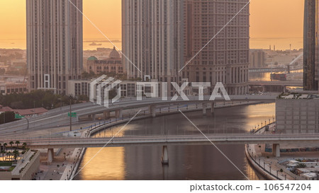 Walking promenade along water canal in Business Bay district of Dubai aerial timelapse. 106547204