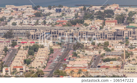 Aerial view of apartment houses and villas in Dubai city near downtown timelapse. Aerial view of apartment houses and villas in Dubai city near downtown timelapse. 106547222