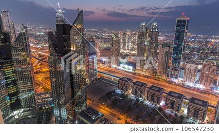 High-rise buildings on Sheikh Zayed Road in Dubai aerial day to night timelapse, UAE. 106547230