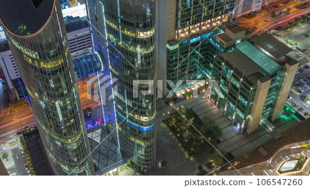Looking down view of the high-rise buildings on Sheikh Zayed Road in Dubai aerial night timelapse, UAE. Looking down view of the high-rise buildings on Sheikh Zayed Road in Dubai aerial night timelapse, UAE. 106547260