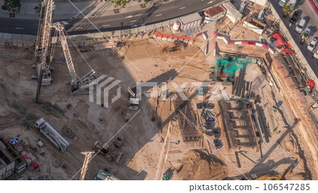 Aerial view construction site with a foundation pit of new skyscraper timelapse. Aerial view construction site with a foundation pit of new skyscraper timelapse. 106547285