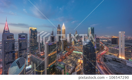 Skyline view of the high-rise buildings on Sheikh Zayed Road in Dubai aerial day to night timelapse, UAE. 106547290