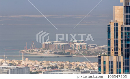 Aerial view of apartment houses and villas in Dubai city near downtown timelapse. Aerial view of apartment houses and villas in Dubai city near downtown timelapse. 106547305