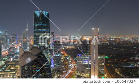 Skyline view of the high-rise buildings on Sheikh Zayed Road in Dubai aerial night timelapse, UAE. Skyline view of the high-rise buildings on Sheikh Zayed Road in Dubai aerial night timelapse, UAE. 106547324