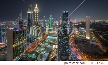 Skyline view of the high-rise buildings on Sheikh Zayed Road in Dubai aerial night timelapse, UAE. 106547366