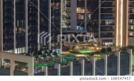 Luxury swimming pool on roof top during amazing evening aerial night timelapse. Luxury swimming pool on roof top during amazing evening aerial night timelapse. 106547457