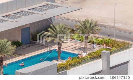 Luxury swimming pool on roof top during amazing sunny day aerial timelapse. Luxury swimming pool on roof top during amazing sunny day aerial timelapse. 106547530