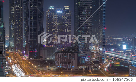 Business bay district skyline with modern architecture night timelapse from above. 106547566