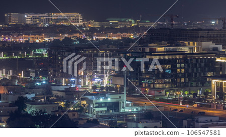 Aerial view to Dubai City Walk district night timelapse from above 106547581
