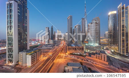 Aerial panoramic view of Dubai Downtown skyline with many towers day to night timelapse. 106547595