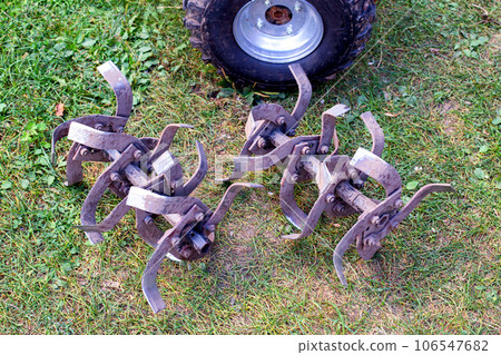 cutters complete with walk-behind tractor for work on the ground. Technique for agriculture. Motor cultivator 106547682