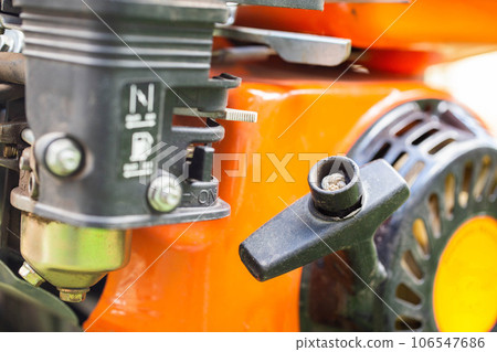 Manual starter handle for starting a walk-behind tractor, close-up 106547686