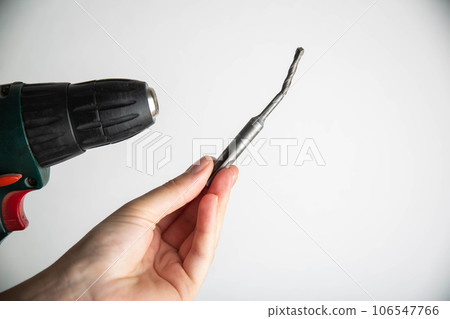 Poor quality broken metal drill on a white background, close-up Poor quality broken metal drill on a white background, close-up 106547766