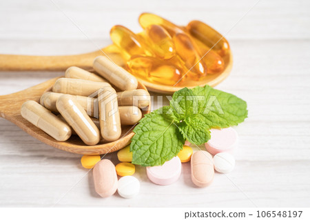 Alternative medicine herbal organic capsule with vitamin E omega 3 fish oil, mineral, drug with herbs leaf natural supplements for healthy good life. 106548197