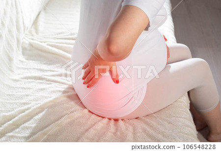 Back pain in pregnant women. Chronic diseases of the spine and musculoskeletal system. Ischalgia and muscle tension. Close-up 106548228