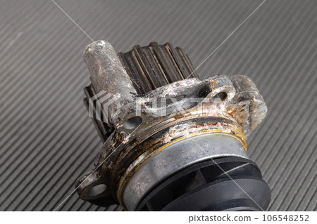 Old leaky car pump. Breakdown of the car pump in the cooling system, macro 106548252