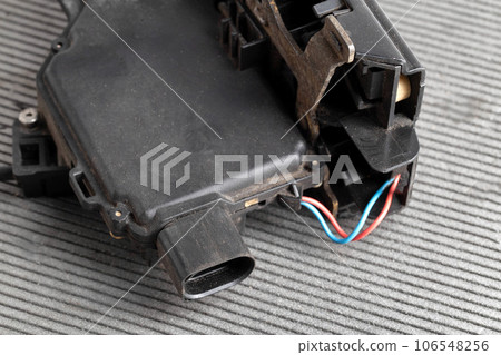 Car electric door lock, close-up. Limit switch failure, automotive part. Car electrical repair, close-up Car electric door lock, close-up. Limit switch failure, automotive part. Car electrical repair, close-up 106548256